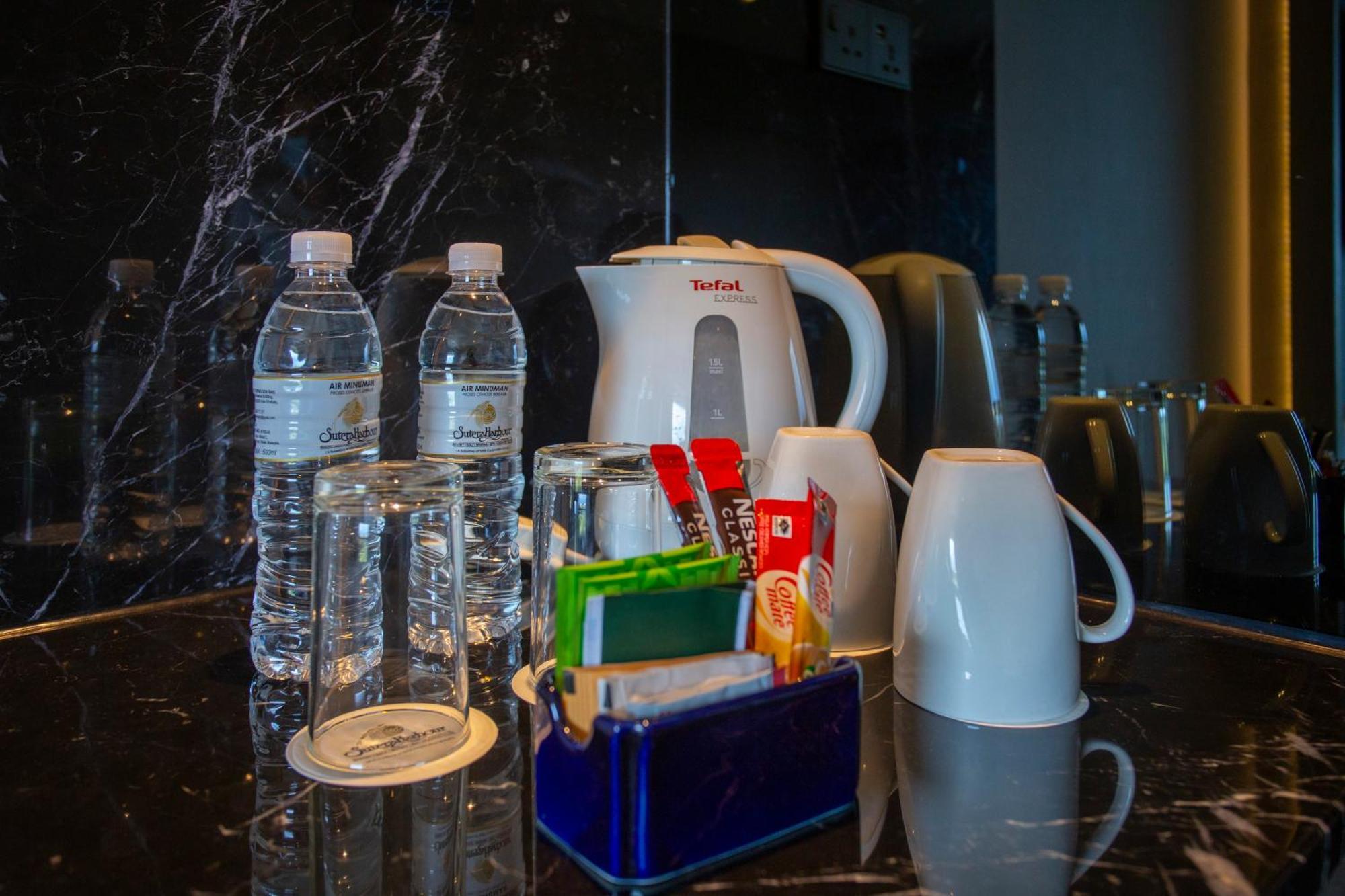 Hotel The Pacific Sutera Kota Kinabalu Esterno foto Bottled water in a hotel room