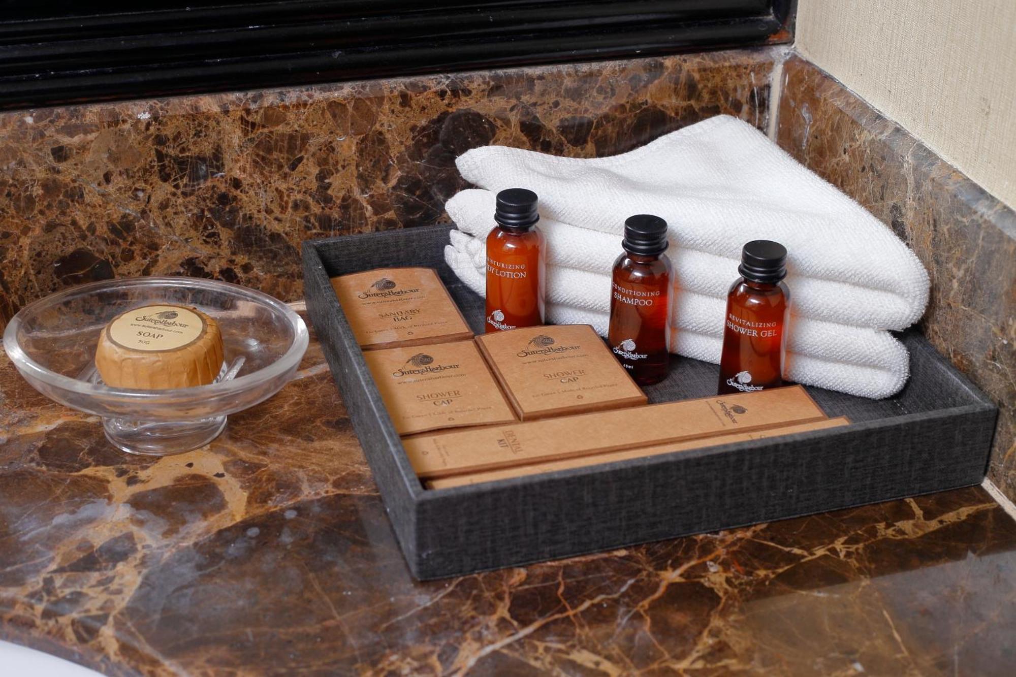Hotel The Pacific Sutera Kota Kinabalu Esterno foto A selection of toiletries in a hotel bathroom